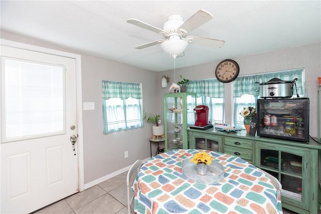 bedroom with ceiling fan and light tile patterned floors