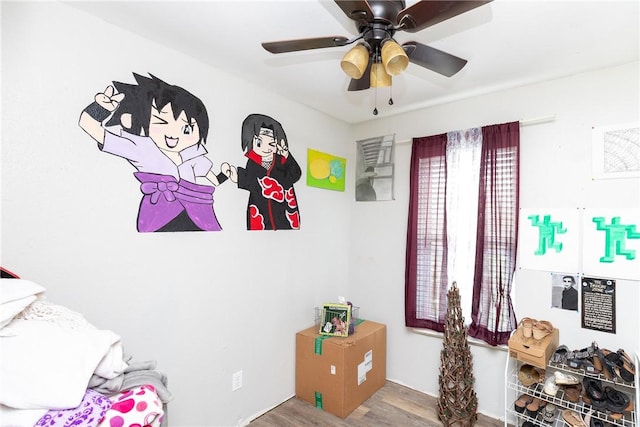 bedroom featuring wood-type flooring and ceiling fan