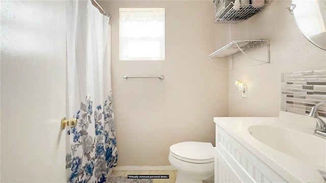 bathroom with vanity, walk in shower, and toilet