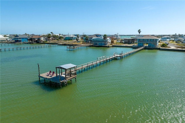 view of dock featuring a water view and a residential view