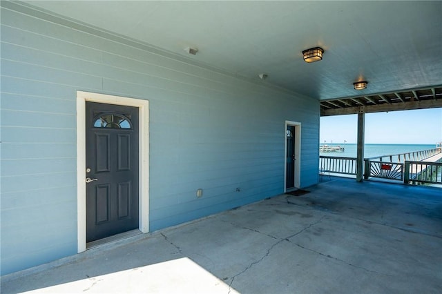 entrance to property with a water view