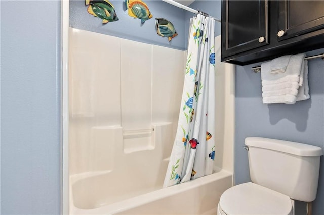 full bath with shower / bath combo with shower curtain and toilet