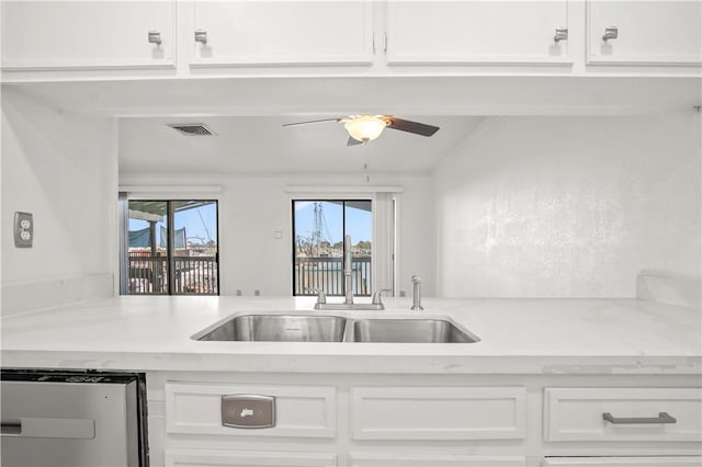 kitchen with sink and white cabinetry