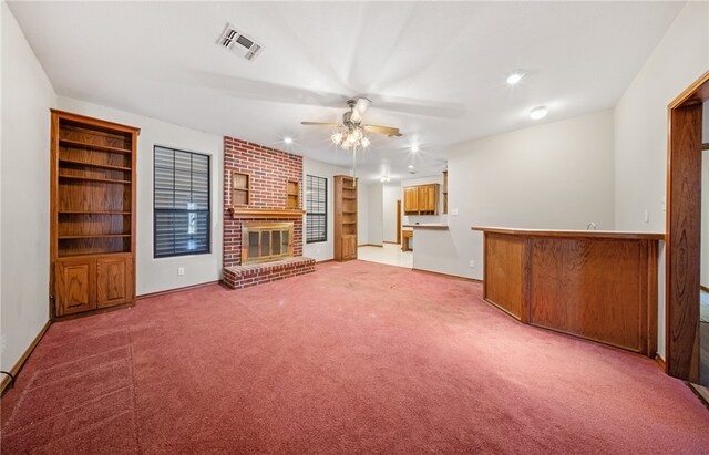 7205 Pharaoh Dr, Corpus Christi, TX 78412 - unfurnished living room with a ceiling fan, carpet, a fireplace, bar, and baseboards