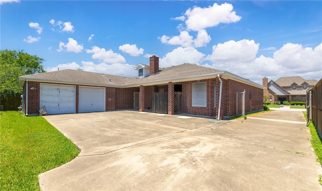 7205 Pharaoh Dr, Corpus Christi, TX 78412 - single story home with driveway, brick siding, a garage, a chimney, and a front lawn