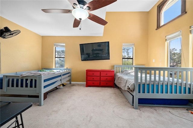 bedroom with carpet, baseboards, and ceiling fan
