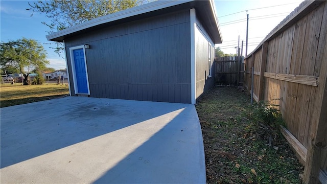 view of side of property with a patio area