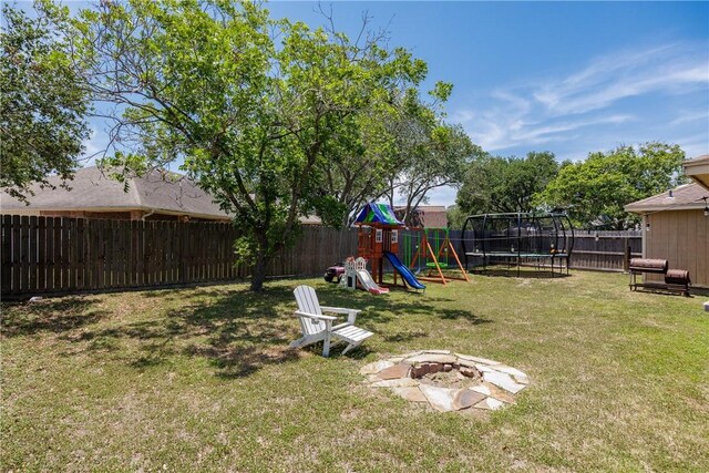 14605 Reagan Dr, Corpus Christi, TX 78410 - view of yard with a trampoline, a playground, and a fire pit