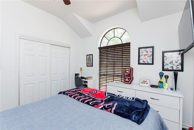 14605 Reagan Dr, Corpus Christi, TX 78410 - bedroom with vaulted ceiling, a closet, and a ceiling fan