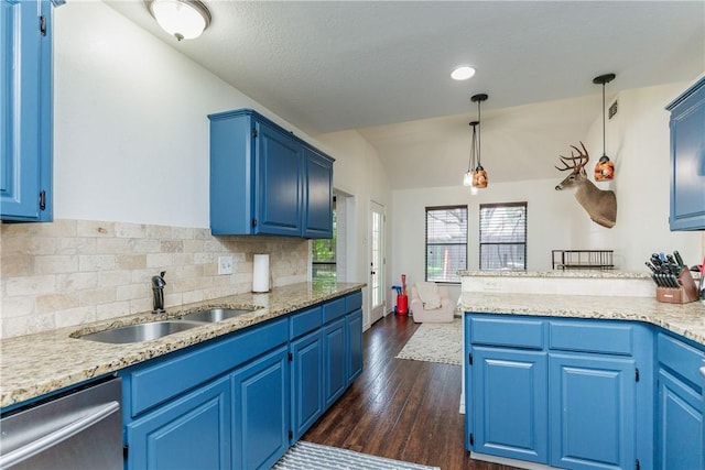 14605 Reagan Dr, Corpus Christi, TX 78410 - kitchen with a sink, dishwasher, blue cabinetry, lofted ceiling, and dark wood-type flooring