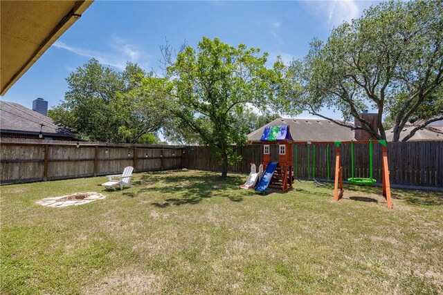 14605 Reagan Dr, Corpus Christi, TX 78410 - view of yard featuring a fire pit and a playground