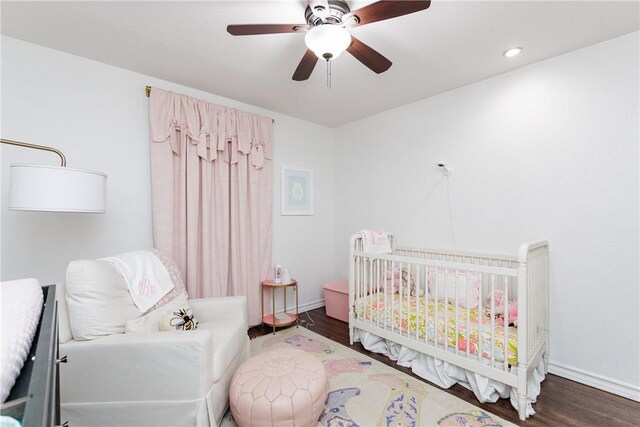 14605 Reagan Dr, Corpus Christi, TX 78410 - bedroom with wood finished floors, a nursery area, baseboards, a ceiling fan, and recessed lighting