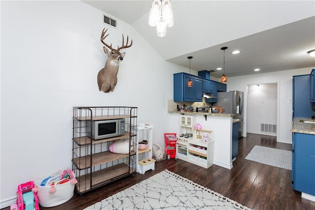 14605 Reagan Dr, Corpus Christi, TX 78410 - kitchen with blue cabinets, dark wood-type flooring, stainless steel microwave, exhaust hood, and recessed lighting