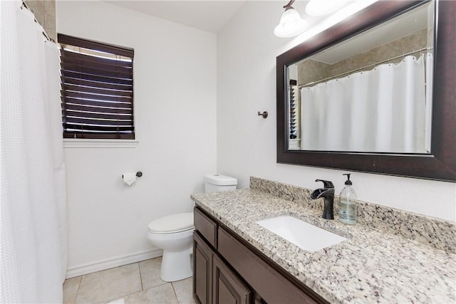 14605 Reagan Dr, Corpus Christi, TX 78410 - full bathroom featuring vanity, toilet, tile patterned flooring, baseboards, and a shower with curtain