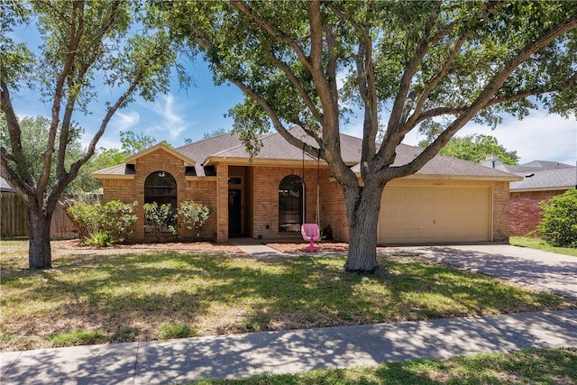 14605 Reagan Dr, Corpus Christi, TX 78410 - ranch-style home with a garage, driveway, and brick siding