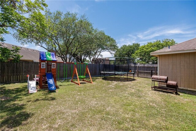 14605 Reagan Dr, Corpus Christi, TX 78410 - view of yard featuring a trampoline and a playground