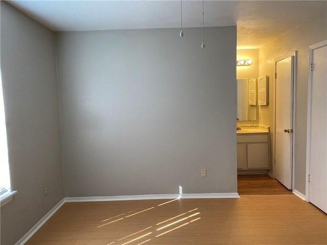 spare room with light hardwood / wood-style floors