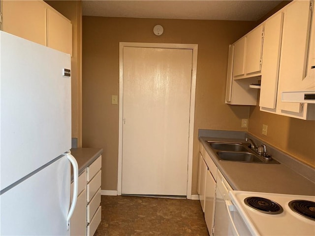 kitchen with white cabinetry, sink, and white appliances