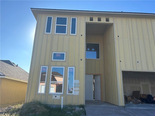 rear view of house with a garage