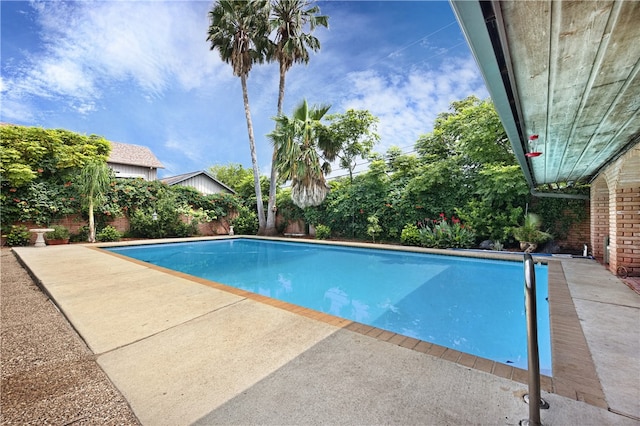 view of swimming pool with a patio