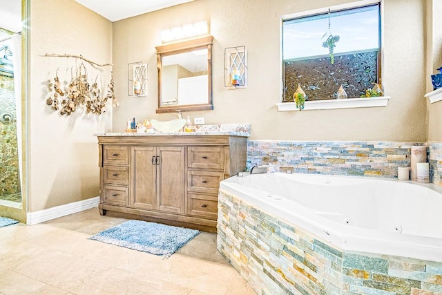 bathroom featuring vanity and a relaxing tiled tub