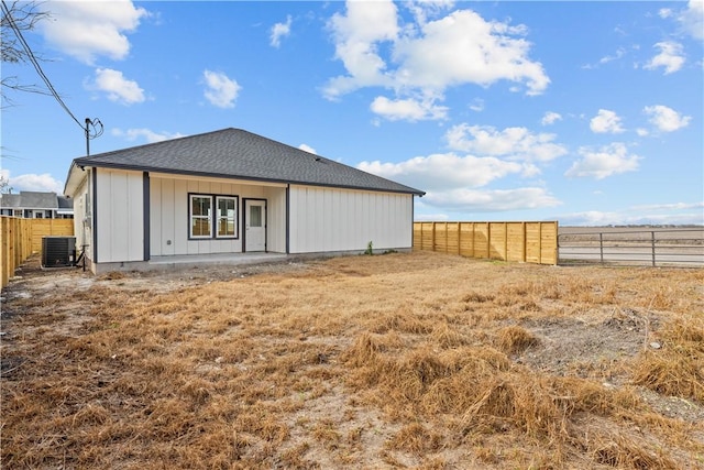 back of property featuring central AC unit