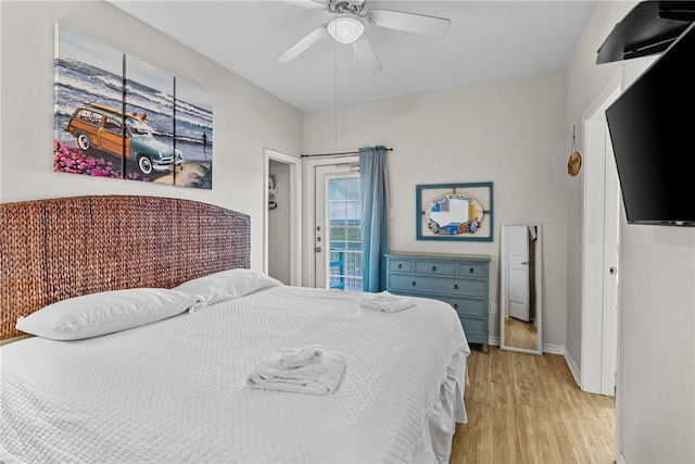 bedroom with light hardwood / wood-style floors, ceiling fan, and access to exterior