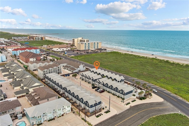 aerial view featuring a view of the beach and a water view