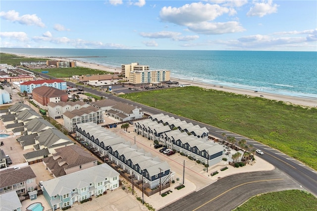 drone / aerial view featuring a view of the beach and a water view