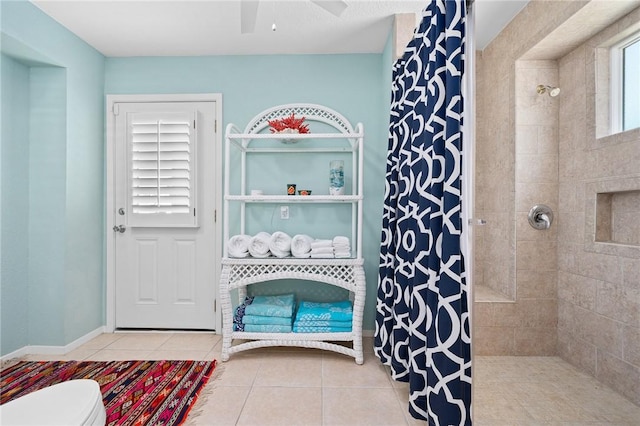 full bath featuring a ceiling fan, tiled shower, toilet, and tile patterned floors