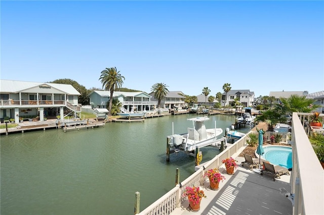 dock area featuring a residential view and a water view