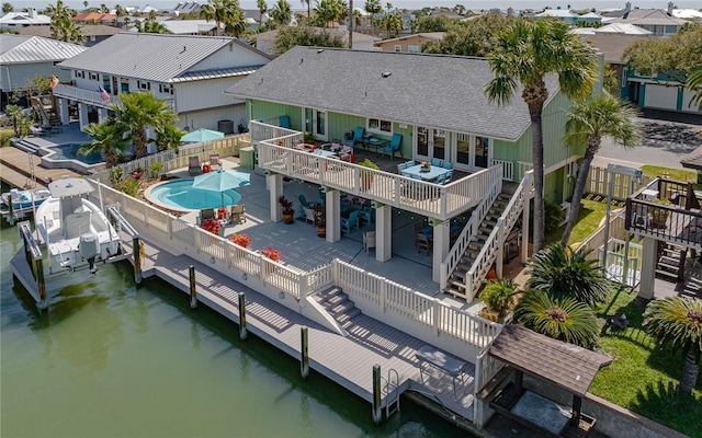 aerial view with a residential view and a water view