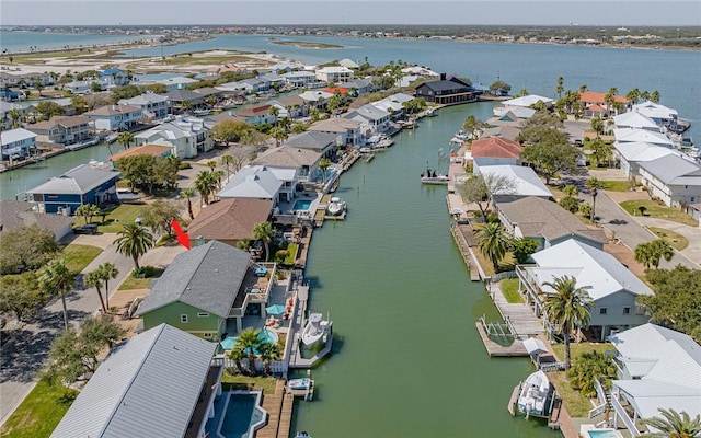 birds eye view of property with a residential view and a water view