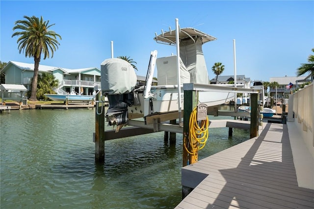 5 Bimini Dr, Rockport, TX 78382 - view of dock with boat lift and a water view