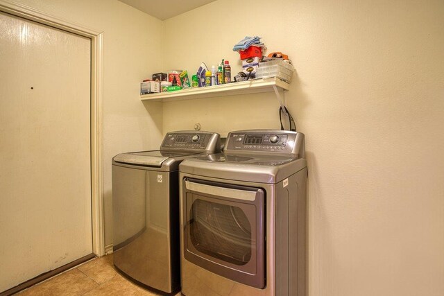 7009 Tocken Ct, Corpus Christi, TX 78414 - laundry area featuring washer and dryer and light tile patterned floors