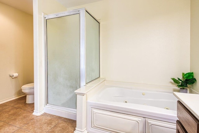 7009 Tocken Ct, Corpus Christi, TX 78414 - full bath with a stall shower, tile patterned flooring, a jetted tub, and vanity