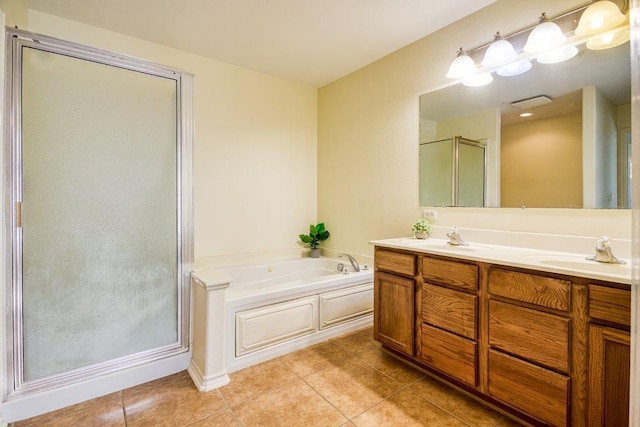 7009 Tocken Ct, Corpus Christi, TX 78414 - bathroom featuring a shower stall, tile patterned floors, a bath, and double vanity