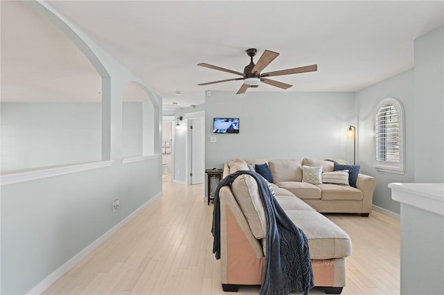 107 Angelfish, Aransas Pass, TX 78336 - living area with a ceiling fan, arched walkways, and light wood-type flooring