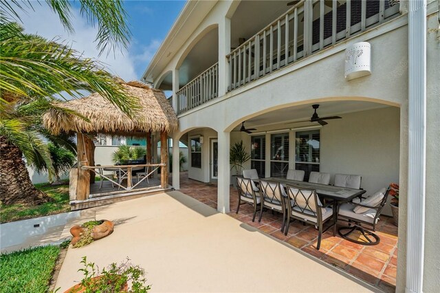 107 Angelfish, Aransas Pass, TX 78336 - patio / terrace featuring outdoor dining space, ceiling fan, a patio, and a gazebo