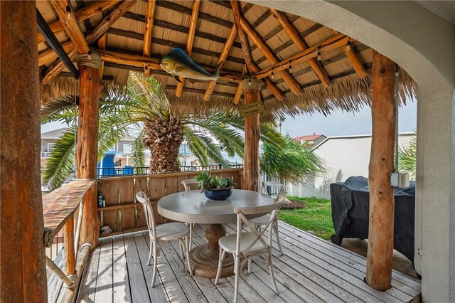 107 Angelfish, Aransas Pass, TX 78336 - wooden deck featuring a gazebo and outdoor dining area