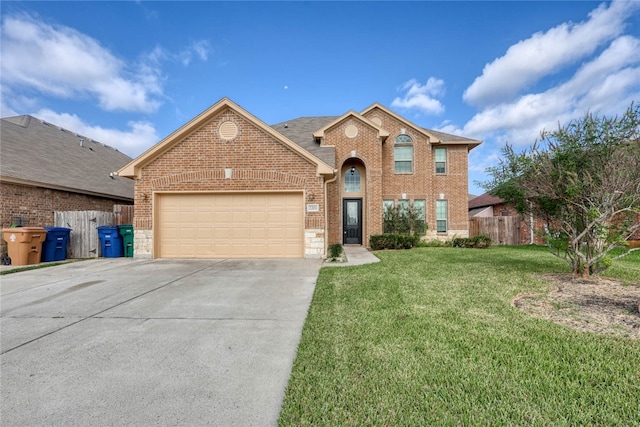 view of property with a garage and a front lawn