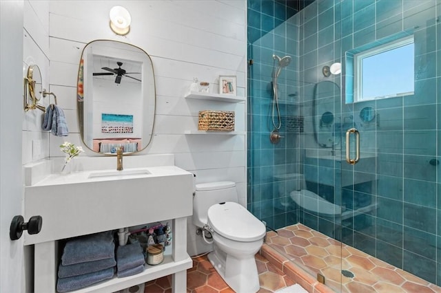 602 Island Retreat Ct, Port Aransas, TX 78373 - bathroom with a stall shower, a ceiling fan, vanity, and tile patterned flooring