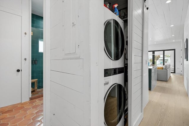 602 Island Retreat Ct, Port Aransas, TX 78373 - laundry room with stacked washer / dryer and recessed lighting