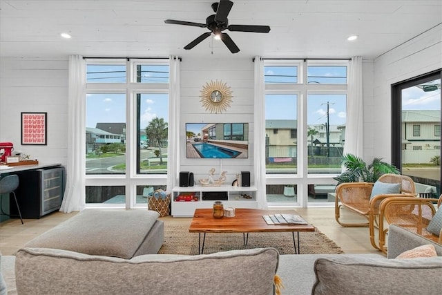 602 Island Retreat Ct, Port Aransas, TX 78373 - living area with wood finished floors, healthy amount of natural light, a ceiling fan, wine cooler, and recessed lighting