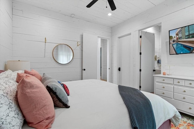 602 Island Retreat Ct, Port Aransas, TX 78373 - bedroom featuring recessed lighting, ceiling fan, and wood walls
