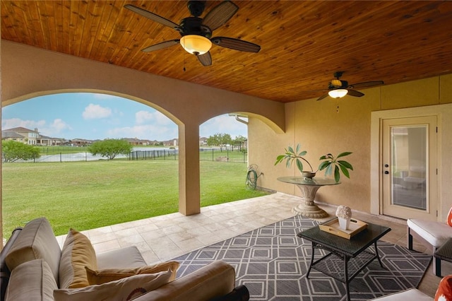 view of patio / terrace with outdoor lounge area, ceiling fan, and a water view