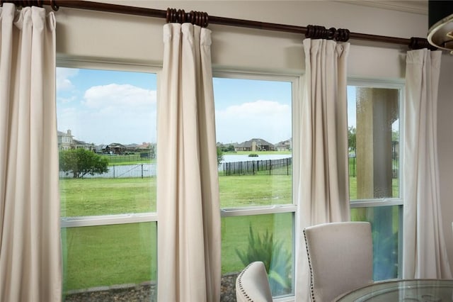 entryway featuring a healthy amount of sunlight and a water view