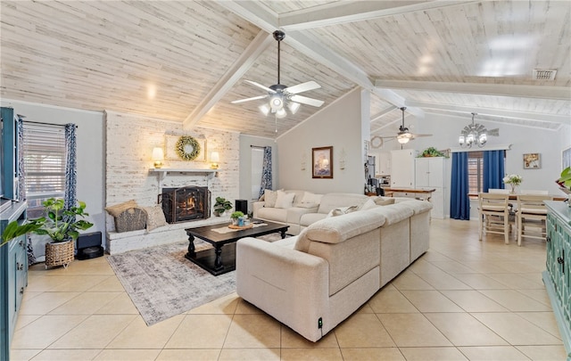 living room featuring wood ceiling, a brick fireplace, beamed ceiling, and light tile patterned floors