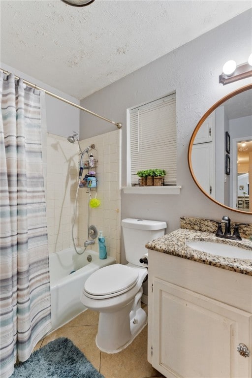 bathroom with shower / bath combo, toilet, tile patterned floors, a textured ceiling, and vanity