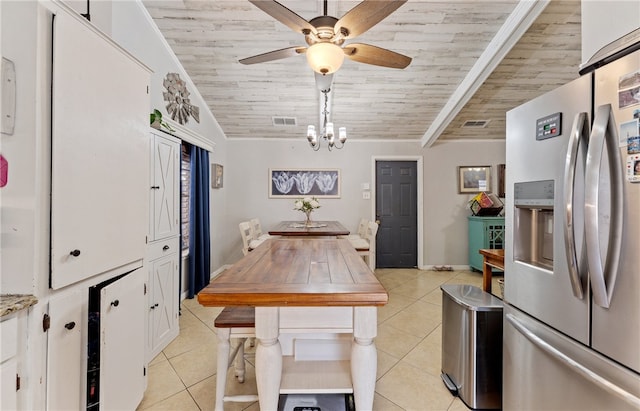 kitchen featuring white cabinets, light tile patterned flooring, wooden ceiling, and stainless steel fridge with ice dispenser